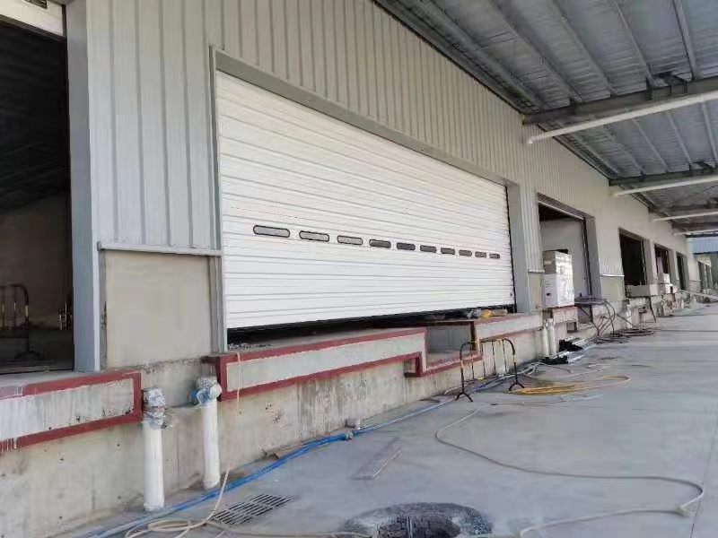 What effect does the color of aluminum roller shutter doors have on indoor light?