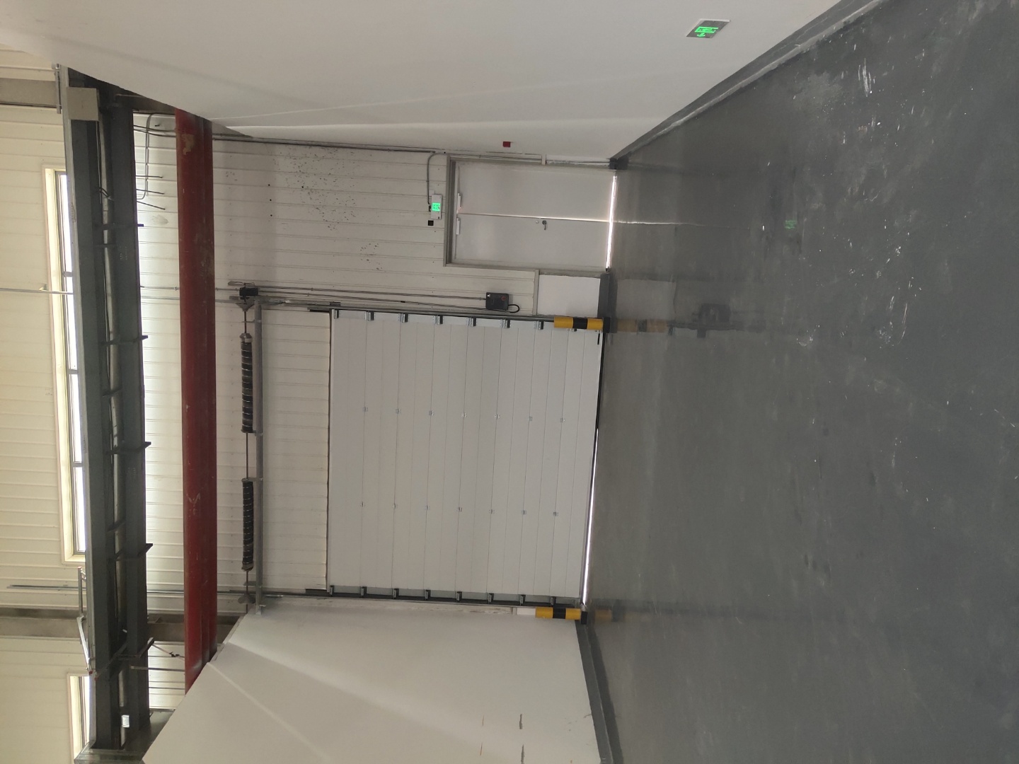 In which industries are industrial sliding doors most widely used?