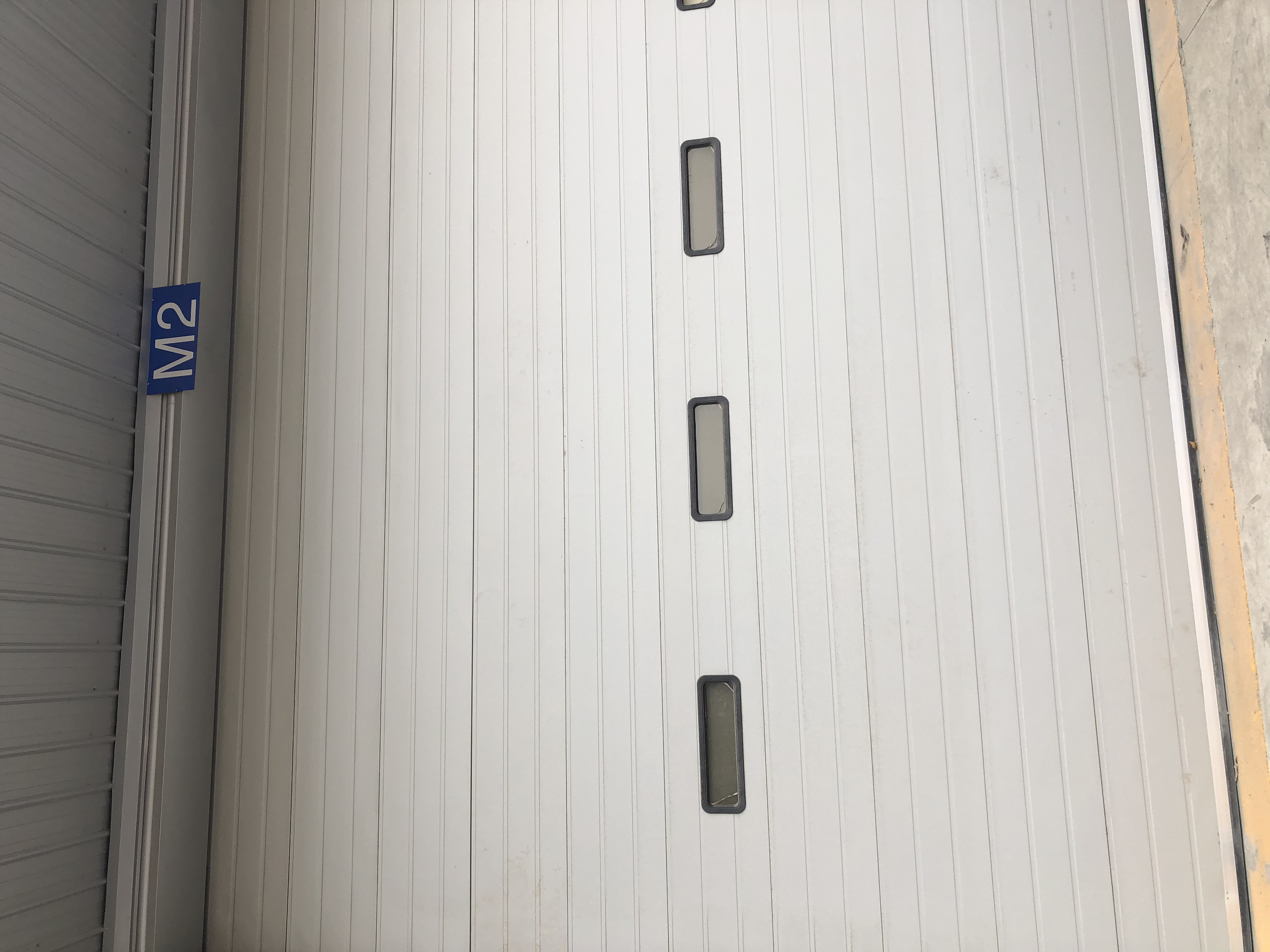 What are the tests for the performance indicators of industrial sliding doors?